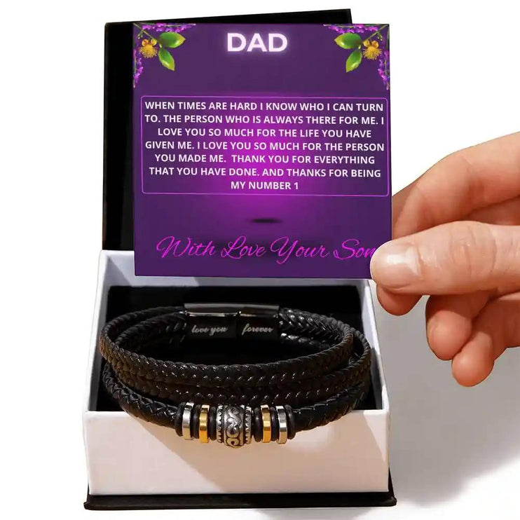 A men's love you forever bracelet in a two-tone box with a to dad greeting card on a white table