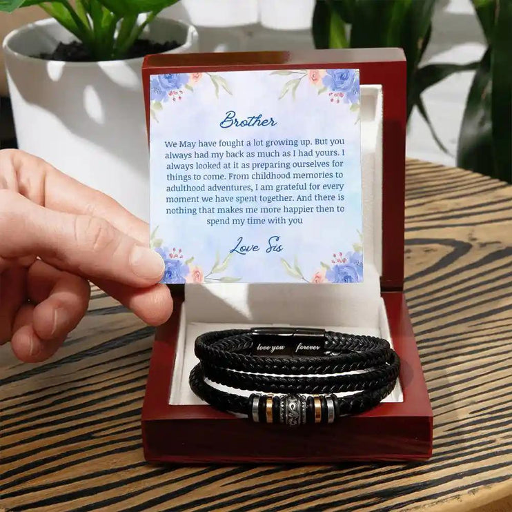 A men's love you forever bracelet in a two-tone box.