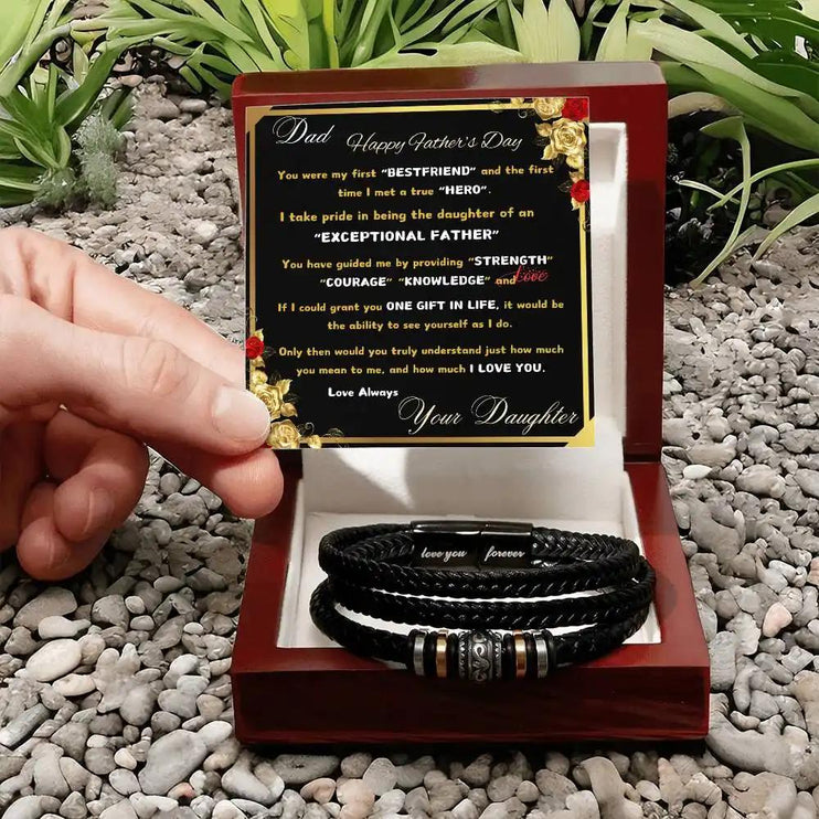 love you forever bracelet in mahogany box on pebbles.
