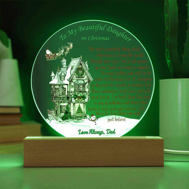 just believe 120v acrylic round plaque on a table with green light