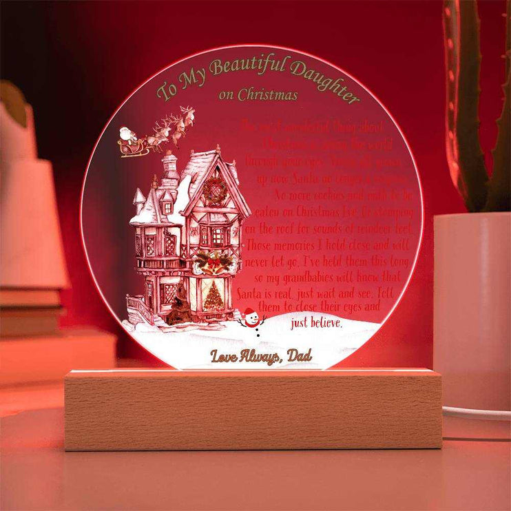 just believe 120v acrylic round plaque on a table with red light