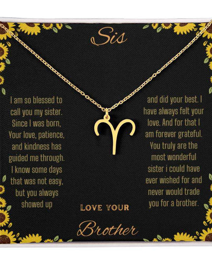Zodiac Symbol Necklace with a yellow gold finish Aries charm on a to sis from brother greeting card inside a two-tone box box