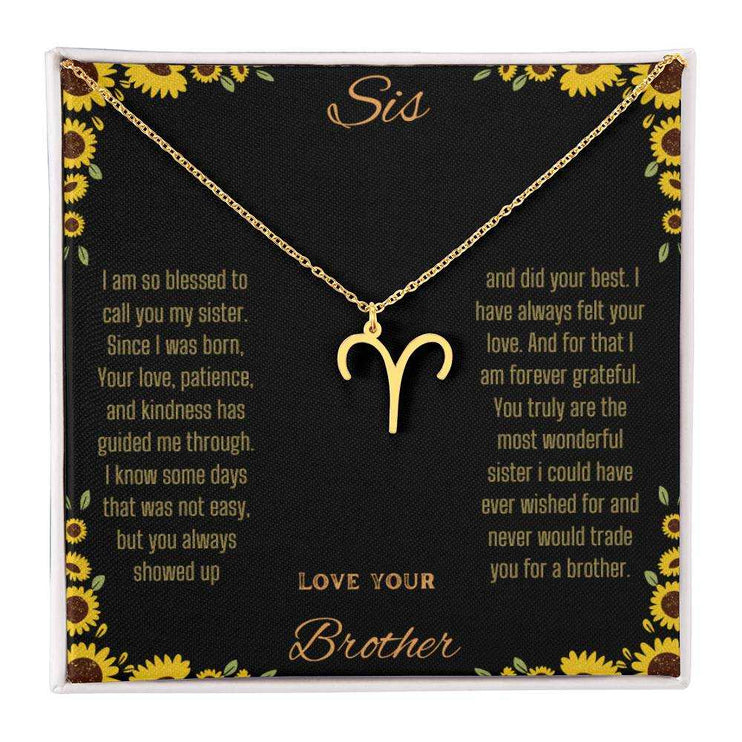 Zodiac Symbol Necklace with a yellow gold finish Aries charm on a to sis from brother greeting card inside a two-tone box box