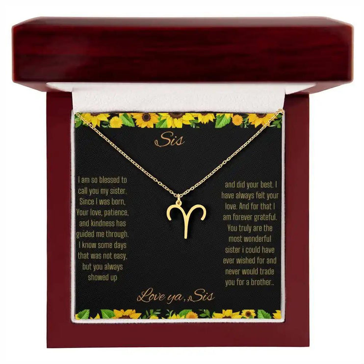   Zodiac Symbol necklace with a yellow gold Aries charm with a to Sis from Sis greeting card in a mahogany box