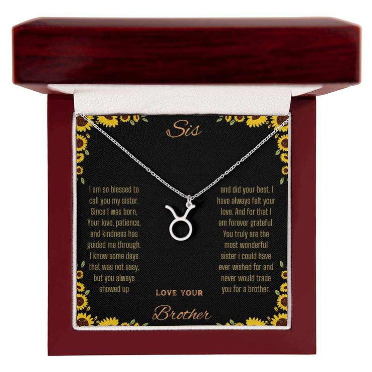 Zodiac Symbol Necklace with a polished stainless-steel            charm on a to sis from brother greeting card inside a mahogany box