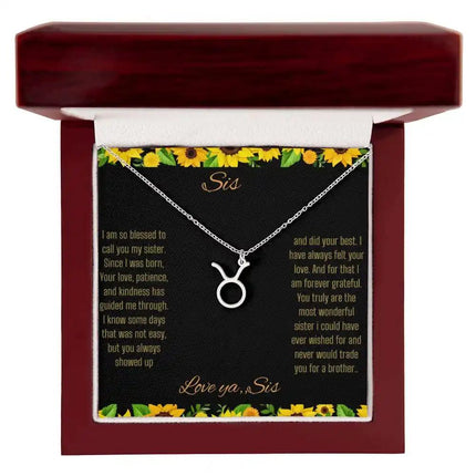 Zodiac Symbol Necklace with a polished stainless-steel Taurus charm on a to sis from sis greeting card inside a mahogany box