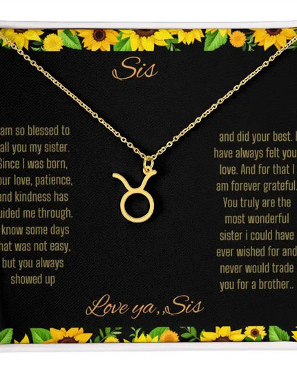 Zodiac Symbol Necklace with a yellow gold finish Taurus charm on a to sis from sis greeting card inside a two-tone box