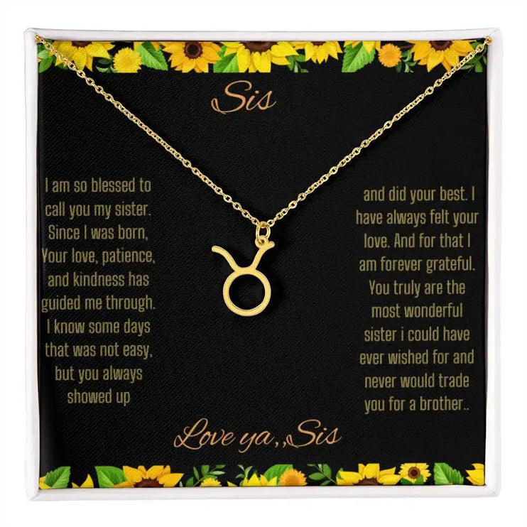 Zodiac Symbol Necklace with a yellow gold finish Taurus charm on a to sis from sis greeting card inside a two-tone box