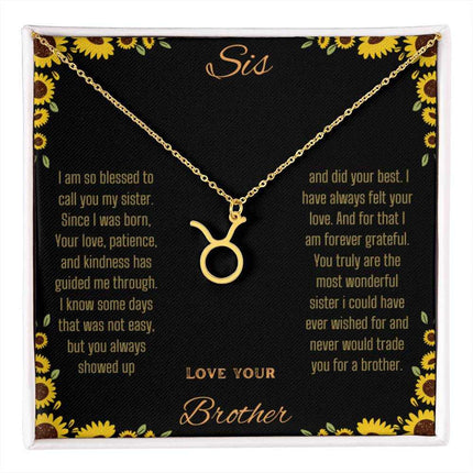Zodiac Symbol Necklace with a yellow gold finish Taurus charm on a to sis from brother greeting card inside a two-tone box box