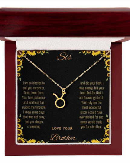 Zodiac Symbol Necklace with a yellow gold finish Taurus charm on a to sis from brother greeting card inside a mahogany box