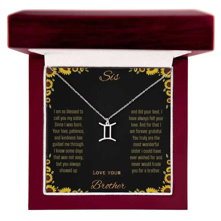 Zodiac Symbol Necklace with a polished stainless-steel Gemini charm on a to sis from brother greeting card inside a mahogany box