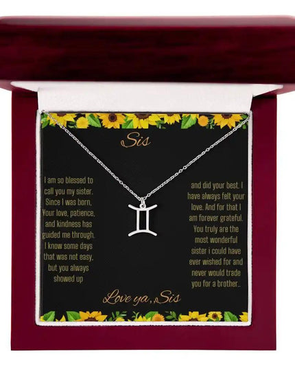 Zodiac Symbol Necklace with a polished stainless-steel Gemini charm on a to sis from sis greeting card inside a mahogany box