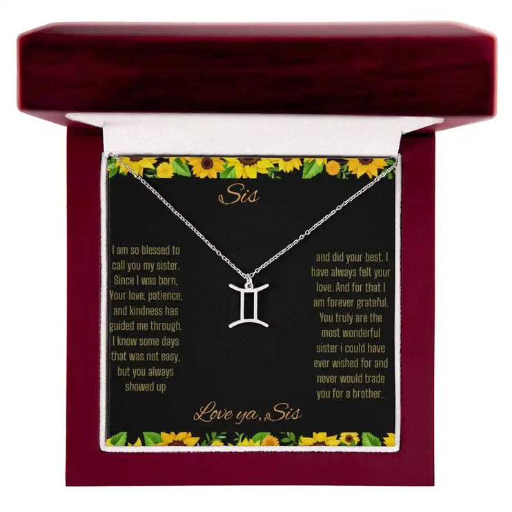 Zodiac Symbol Necklace with a polished stainless-steel Gemini charm on a to sis from sis greeting card inside a mahogany box