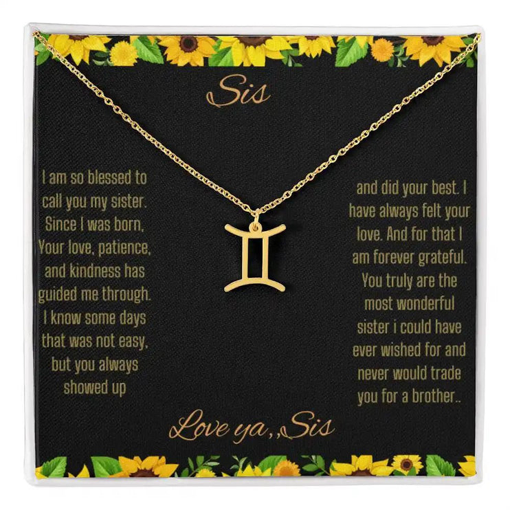 Zodiac Symbol Necklace with a yellow gold finish Gemini charm on a to sis from sis greeting card inside a two-tone box
