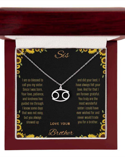 Zodiac Symbol Necklace with a polished stainless-steel Cancer charm on a to sis from brother greeting card inside a mahogany box