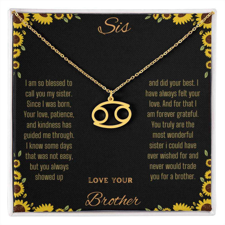 Zodiac Symbol Necklace with a yellow gold finish Cancer charm on a to sis from brother greeting card inside a two-tone box box