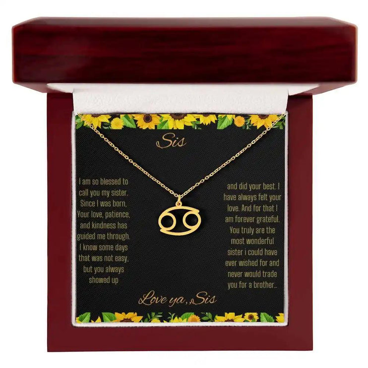 Zodiac Symbol Necklace with a yellow gold finish Cancer charm on a to sis from sis greeting card inside a mahogany box