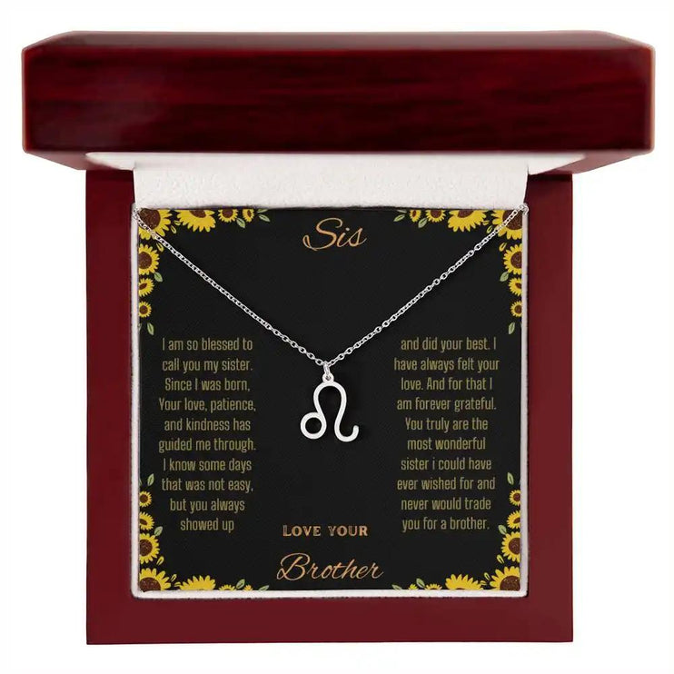 Zodiac Symbol Necklace with a polished stainless-steel Leo charm on a to sis from brother greeting card inside a mahogany box