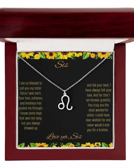 Zodiac Symbol Necklace with a polished stainless-steel Leo charm on a to sis from sis greeting card inside a mahogany box