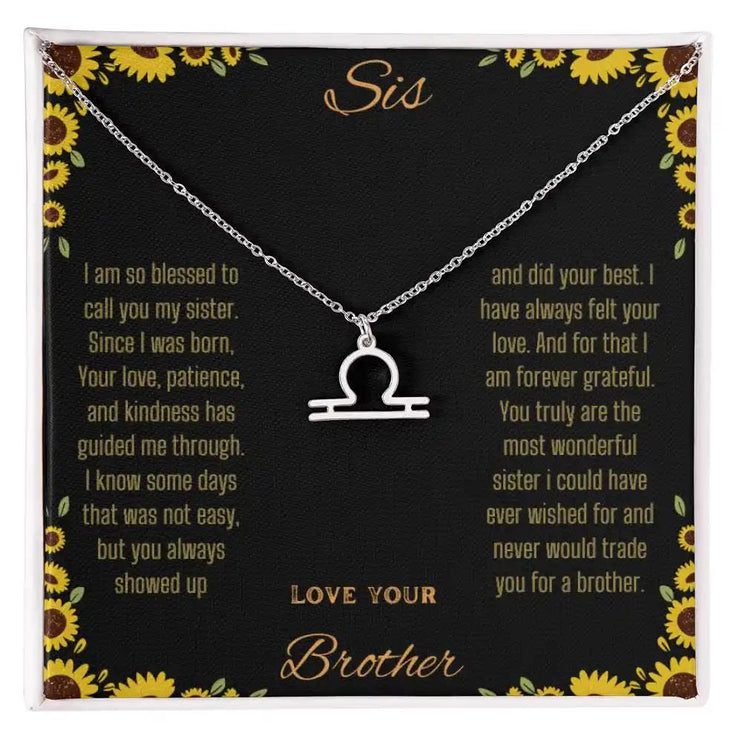 Zodiac Symbol Necklace with a polished stainless-steel Libra charm on a to sis from brother greeting card inside a two-tone box