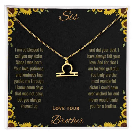 Zodiac Symbol Necklace with a yellow gold finish Libra charm on a to sis from brother greeting card inside a two-tone box box