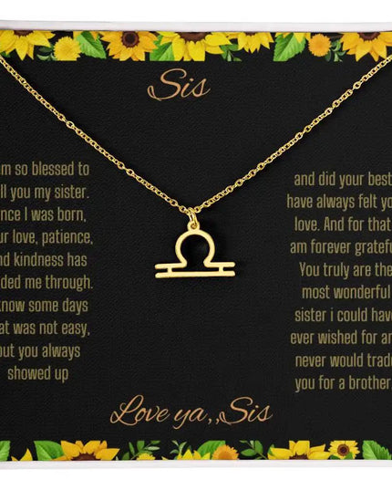 Zodiac Symbol Necklace with a yellow gold finish Libra charm on a to sis from sis greeting card inside a two-tonebox