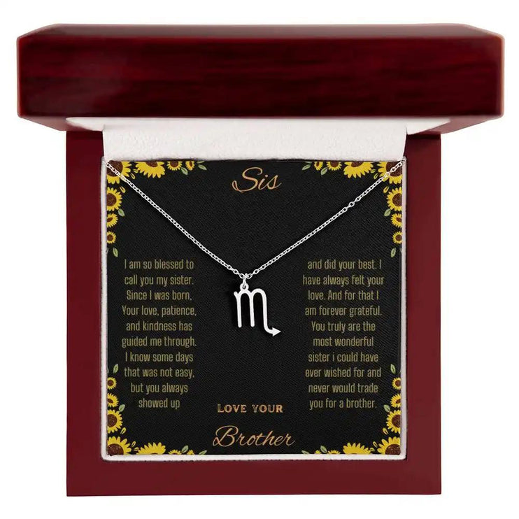 Zodiac Symbol Necklace with a polished stainless-steel Scorpio charm on a to sis from brother greeting card inside a mahogany box