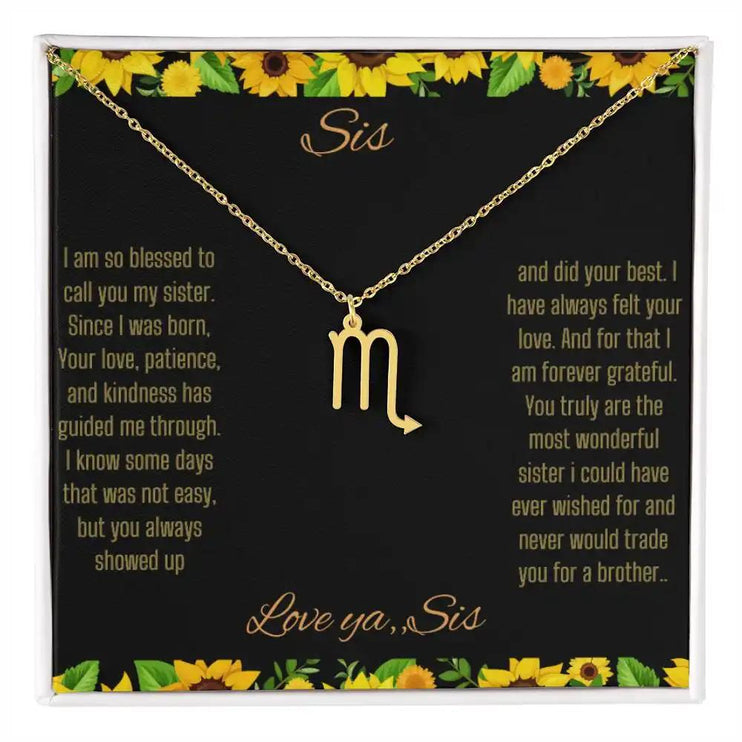 Zodiac Symbol Necklace with a yellow gold finish Scorpio charm on a to sis from sis greeting card inside a two-tone box