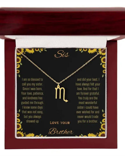 Zodiac Symbol Necklace with a yellow gold finish Scorpio charm on a to sis from brother greeting card inside a mahogany box