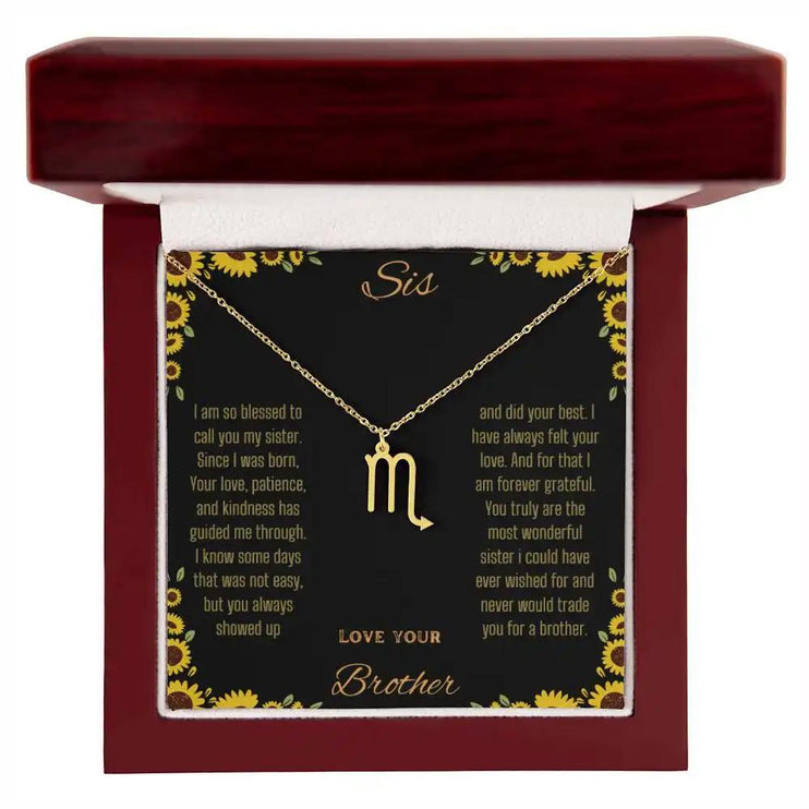 Zodiac Symbol Necklace with a yellow gold finish Scorpio charm on a to sis from brother greeting card inside a mahogany box