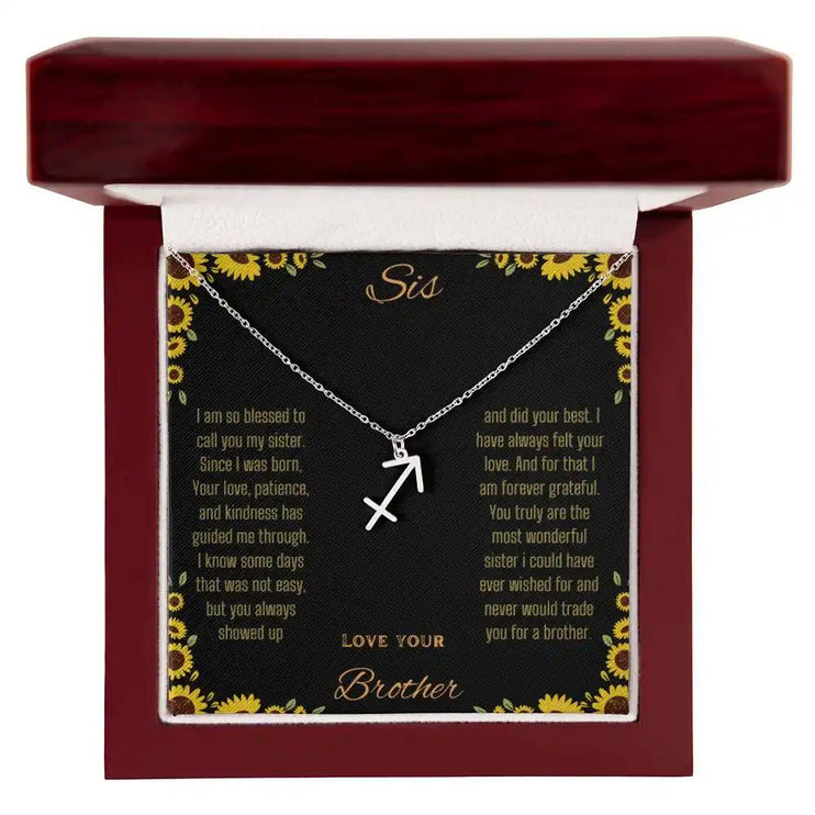 Zodiac Symbol Necklace with a polished stainless-steel Sagittarius charm on a to sis from brother greeting card inside a mahogany box