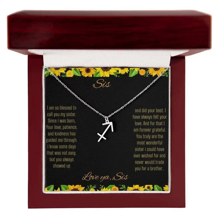 Zodiac Symbol Necklace with a polished stainless-steel Sagittarius charm on a to sis from sis greeting card inside a mahogany box