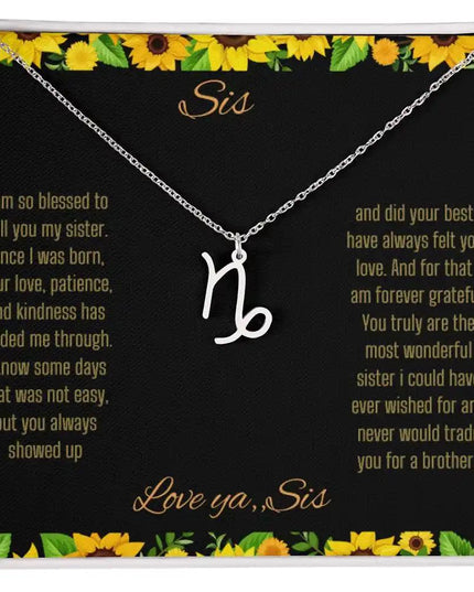 Zodiac Symbol Necklace with a polished stainless-steel Capricorn charm on a to sis from sis greeting card inside a two-tone box