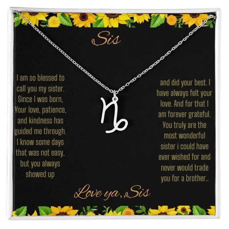Zodiac Symbol Necklace with a polished stainless-steel Capricorn charm on a to sis from sis greeting card inside a two-tone box
