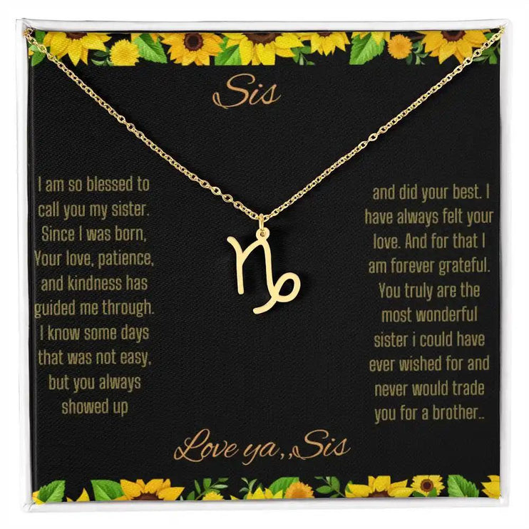 Zodiac Symbol Necklace with a yellow gold finish Capricorn charm on a to sis from sis greeting card inside a two-tone box