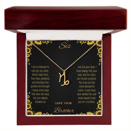 Zodiac Symbol Necklace with a yellow gold finish Capricorn charm on a to sis from brother greeting card inside a mahogany box