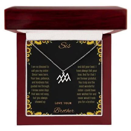 Zodiac Symbol Necklace with a polished stainless-steel Aquarius charm on a to sis from brother greeting card inside a mahogany box