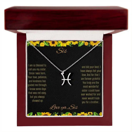Zodiac Symbol Necklace with a polished stainless steel Pisces charm on a to sis from sis greeting card inside a mahogany box