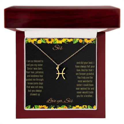 Zodiac Symbol Necklace with a yellow gold finish Pisces charm on a to sis from sis greeting card inside a mahogany box