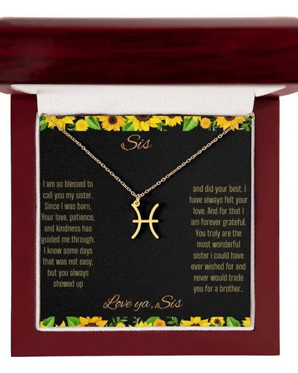 Zodiac Symbol Necklace with a yellow gold finish Pisces charm on a to sis from sis greeting card inside a mahogany box