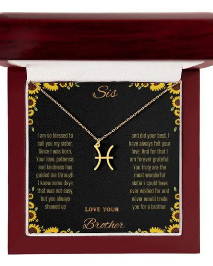 Zodiac Symbol Necklace with a yellow gold finish Pisces charm on a to sis from brother greeting card inside a mahogany box