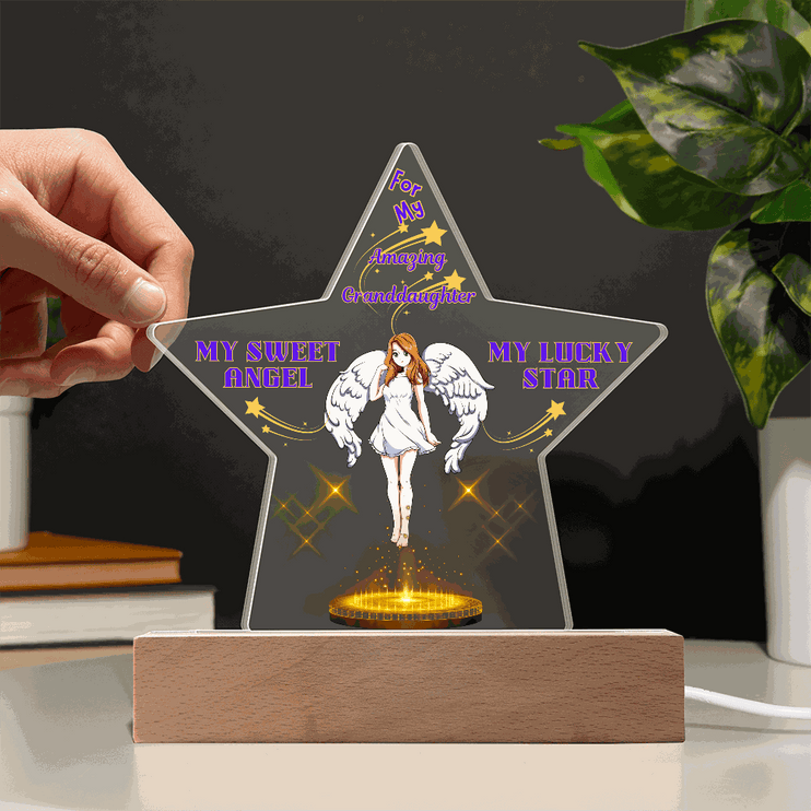 120v acrylic star plaque on an office desk with dark background