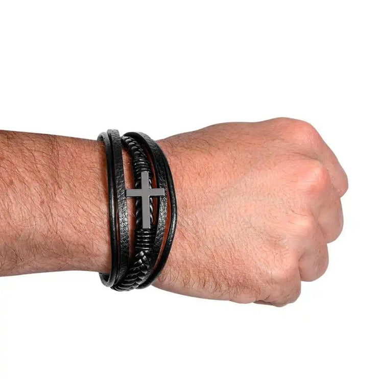 cross leather bracelet on wrist.