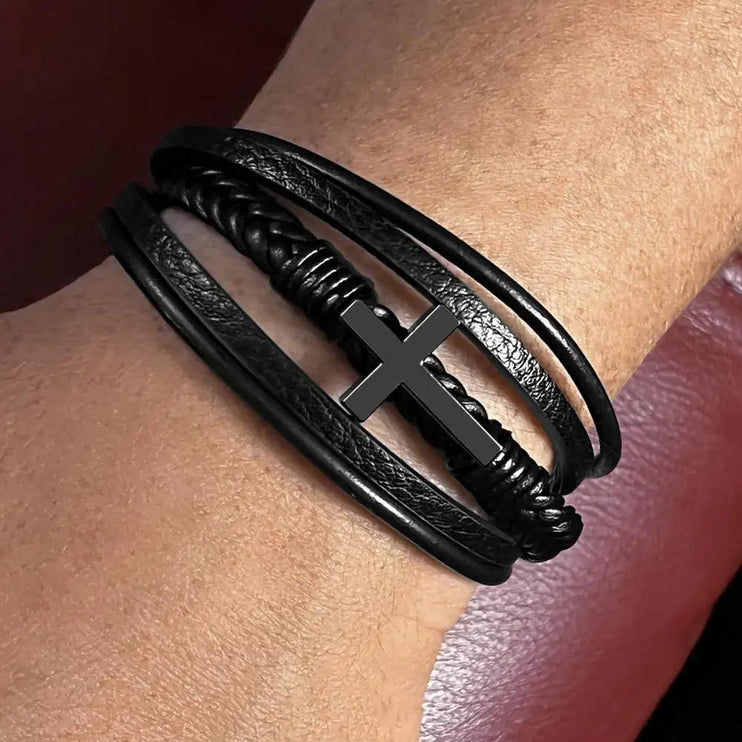 cross leather bracelet on model's wrist