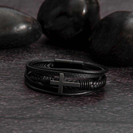 cross leather bracelet on a black stone