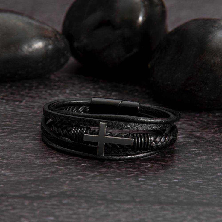 cross leather bracelet on a black stone