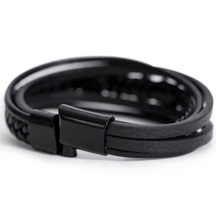 A men's cross leather bracelet on a white background with no box