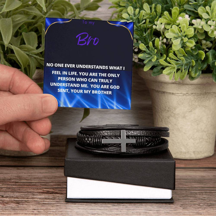 men's cross leather bracelet with to my brother message card and standard box with plants in backdrop