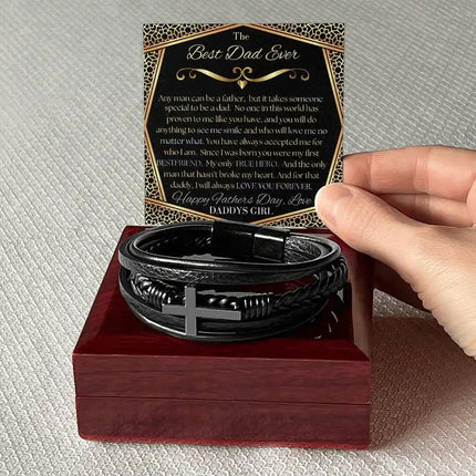 cross leather bracelet up close on top of mahogany box.