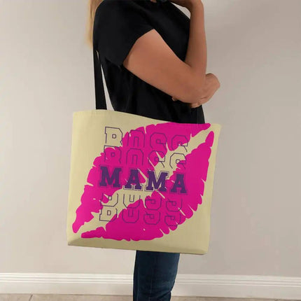 a classic tote bag on a model's shoulder facing right with black strap.